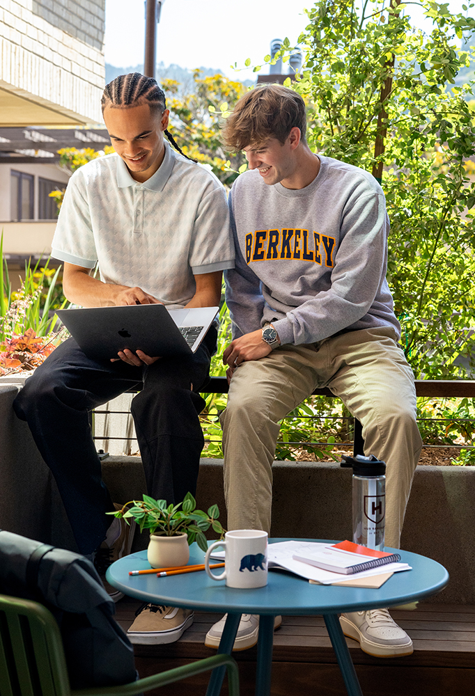 Two friends studying outside together